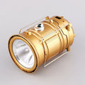 Gold lantern with front flashlight lens