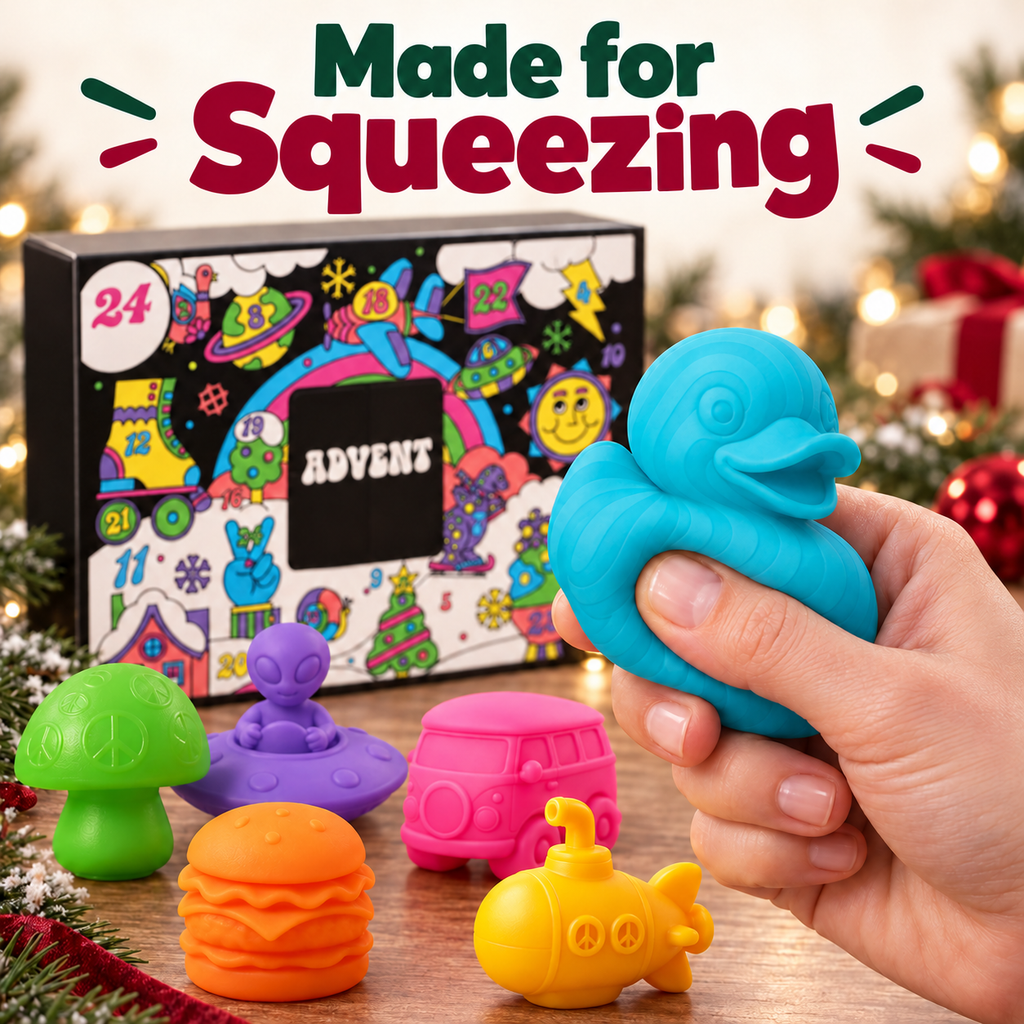 An adult hand gently squeezing a turquoise duck toy beside the Advent calendar.