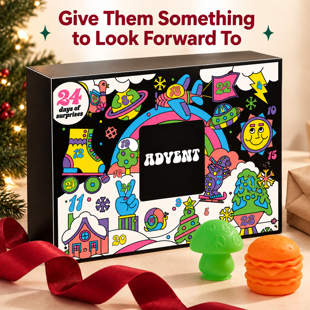 Advent calendar gift box with cranberry ribbon and two colorful squeeze toys.