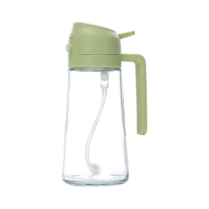 Green spray-and-pour oil bottle with a clear body and handle
