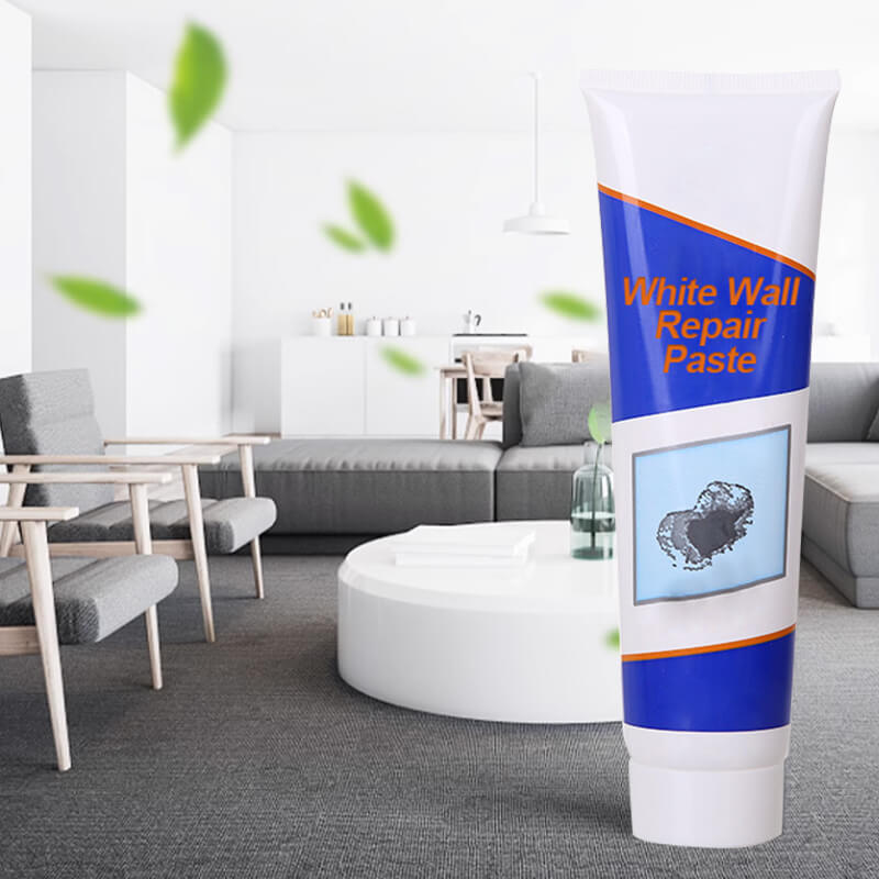 Blue tube of white wall repair paste in a living room setting