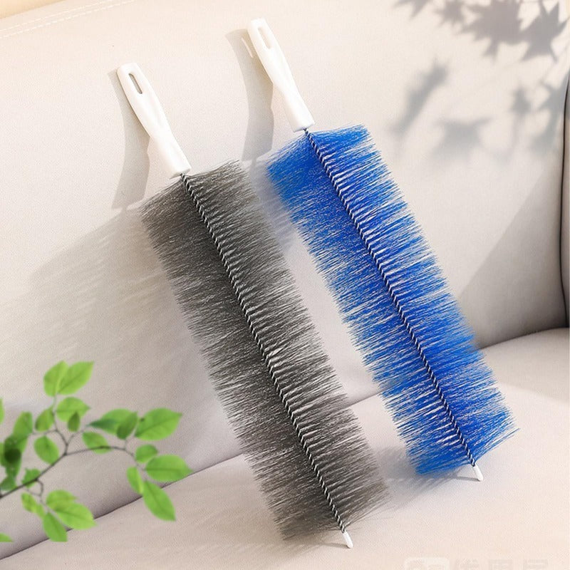 Blue and gray flexible brushes beside household decor